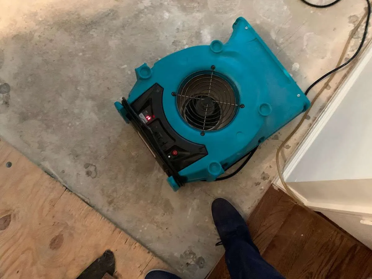 Air mover drying subfloor during Leak Detection & Repair in Garfield Heights